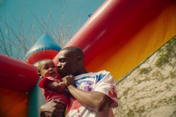 Movie still from “Huey Briss & Nikobeats - Grace Park Legend” (2021), directed by Michael Priestley – Medium shot, Low angle