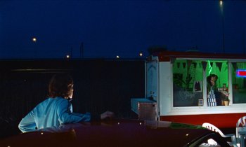 Movie still from “Earl Elliot - Training for a Marathon” (2021), directed by Danny Griffioen – Medium shot, Over the shoulder angle