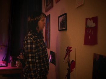 Movie still from “Smoothboi Ezra - Stuck” (2021), directed by Arthur Studholme – Medium shot, Low angle