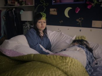 Movie still from “Smoothboi Ezra - Stuck” (2021), directed by Arthur Studholme – Medium shot, High angle