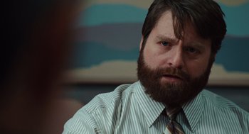 Movie still from “Up in the Air” (2009), directed by Jason Reitman – A person with a beard wearing a tie; Close Up shot, Over the shoulder angle
