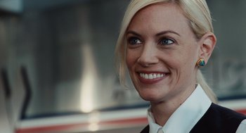 Movie still from “Up in the Air” (2009), directed by Jason Reitman – A person wearing a suit and tie; Close Up shot, Over the shoulder angle