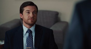 Movie still from “Up in the Air” (2009), directed by Jason Reitman – A person wearing a suit and tie; Close Up shot, Over the shoulder angle