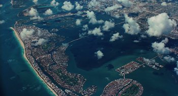Movie still from “Up in the Air” (2009), directed by Jason Reitman – An aerial view of a city and a body of water; Extreme Wide shot, High angle