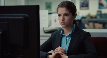 Movie still from “Up in the Air” (2009), directed by Jason Reitman – A woman sitting at a computer in front of a computer monitor; Close Up shot, Over the shoulder angle