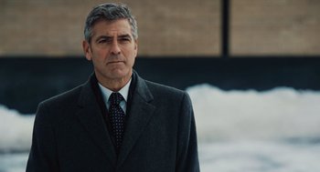 Movie still from “Up in the Air” (2009), directed by Jason Reitman – A person wearing a suit and tie; Close Up shot, Over the shoulder angle