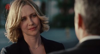 Movie still from “Up in the Air” (2009), directed by Jason Reitman – A person wearing a suit; Close Up shot, Over the shoulder angle