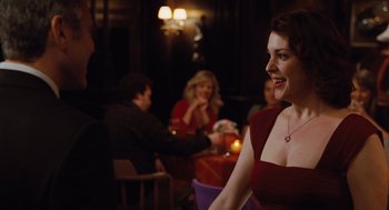 Movie still from “Up in the Air” (2009), directed by Jason Reitman – A group of people sitting around a table; Medium shot, Over the shoulder angle