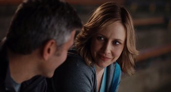 Movie still from “Up in the Air” (2009), directed by Jason Reitman – A man and a woman sitting next to each other; Close Up shot, Over the shoulder angle