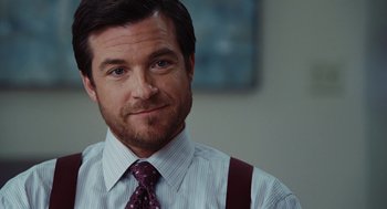 Movie still from “Up in the Air” (2009), directed by Jason Reitman – A person wearing a shirt and a tie; Close Up shot, Over the shoulder angle
