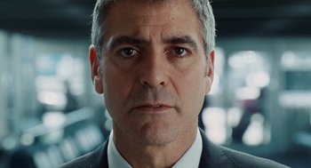 Movie still from “Up in the Air” (2009), directed by Jason Reitman – A person wearing a suit and tie; Close Up shot, Low angle