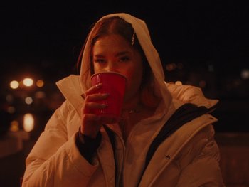 Movie still from “I M U R - Case of You” (2021), directed by Sebastian Hill-Esbrand – Medium shot, Low angle