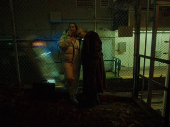 Movie still from “I M U R - Case of You” (2021), directed by Sebastian Hill-Esbrand – Medium shot, Low angle