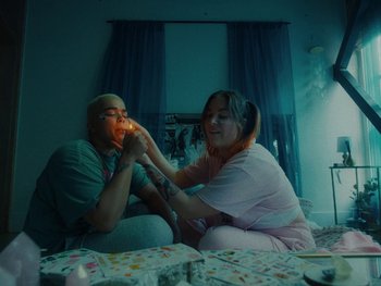 Movie still from “I M U R - Case of You” (2021), directed by Sebastian Hill-Esbrand – Medium shot, High angle