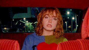 Movie still from “Mallory Merk - Strangers” (2021), directed by Kevin Lombardo – Medium shot, High angle