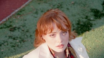 Movie still from “Mallory Merk - Strangers” (2021), directed by Kevin Lombardo – Close Up shot, High angle
