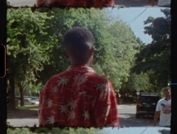 Movie still from “Flower Bomb - Come Together” (2020), directed by Benton Robertson – Medium shot, High angle
