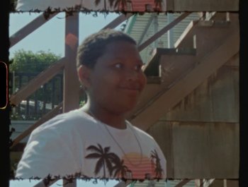 Movie still from “Flower Bomb - Come Together” (2020), directed by Benton Robertson – Close Up shot, High angle