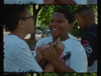 Movie still from “Flower Bomb - Come Together” (2020), directed by Benton Robertson – Medium shot, High angle