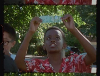 Movie still from “Flower Bomb - Come Together” (2020), directed by Benton Robertson – Close Up shot, Low angle