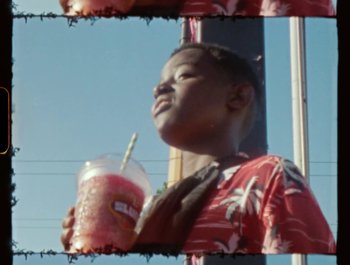 Movie still from “Flower Bomb - Come Together” (2020), directed by Benton Robertson – Close Up shot, Low angle