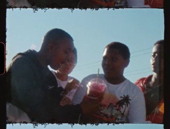 Movie still from “Flower Bomb - Come Together” (2020), directed by Benton Robertson – Medium shot, High angle