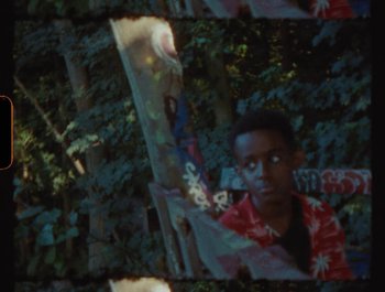Movie still from “Flower Bomb - Come Together” (2020), directed by Benton Robertson – Medium shot, High angle