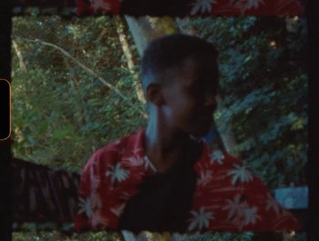 Movie still from “Flower Bomb - Come Together” (2020), directed by Benton Robertson – Medium shot, High angle