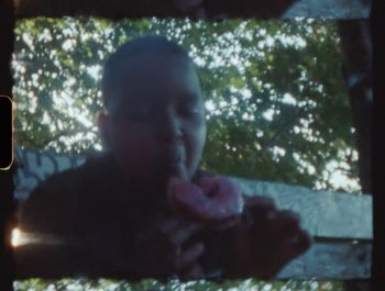Movie still from “Flower Bomb - Come Together” (2020), directed by Benton Robertson – Extreme Close Up shot, Overhead angle