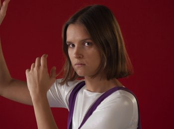 Movie still from “Carlota Flâneur - Generation of the Young Flesh” (2020), directed by Carles Pons Altimira – Medium shot, Low angle