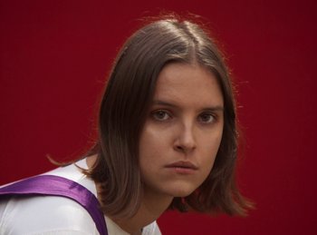 Movie still from “Carlota Flâneur - Generation of the Young Flesh” (2020), directed by Carles Pons Altimira – Close Up shot, Low angle