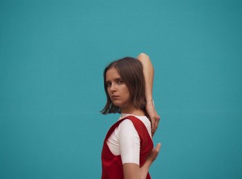 Movie still from “Carlota Flâneur - Generation of the Young Flesh” (2020), directed by Carles Pons Altimira – Medium shot, Low angle