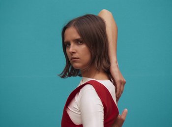 Movie still from “Carlota Flâneur - Generation of the Young Flesh” (2020), directed by Carles Pons Altimira – Medium shot, Low angle