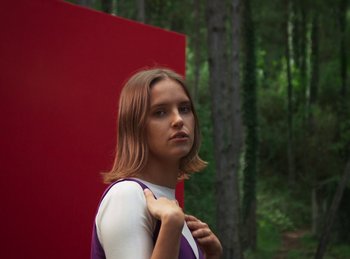 Movie still from “Carlota Flâneur - Generation of the Young Flesh” (2020), directed by Carles Pons Altimira – Medium shot, Low angle