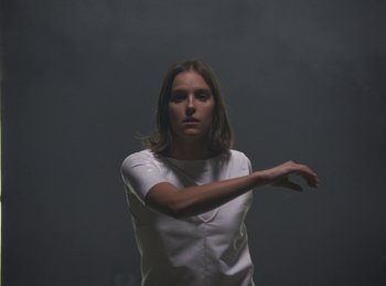 Movie still from “Carlota Flâneur - Generation of the Young Flesh” (2020), directed by Carles Pons Altimira – Medium shot, Low angle