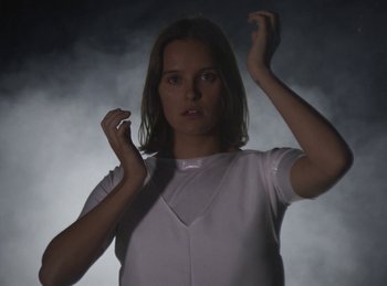 Movie still from “Carlota Flâneur - Generation of the Young Flesh” (2020), directed by Carles Pons Altimira – Medium shot, Low angle