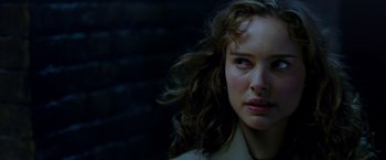 Movie still from “V for Vendetta” (2005), directed by James McTeigue – A person with long hair; Close Up shot, Over the shoulder angle