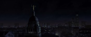 Movie still from “V for Vendetta” (2005), directed by James McTeigue – A view of a city at night from a building; Extreme Wide shot, Low angle