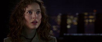 Movie still from “V for Vendetta” (2005), directed by James McTeigue – A person looking at the camera; Close Up shot, Over the shoulder angle