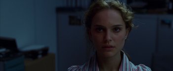 Movie still from “V for Vendetta” (2005), directed by James McTeigue – A person wearing a striped shirt; Close Up shot, Over the shoulder angle