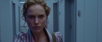 Movie still from “V for Vendetta” (2005), directed by James McTeigue – A person with a backpack; Close Up shot, Low angle