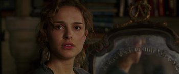 Movie still from “V for Vendetta” (2005), directed by James McTeigue – A person looking at the camera; Close Up shot, Over the shoulder angle