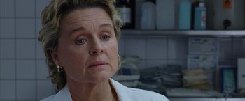 Movie still from “V for Vendetta” (2005), directed by James McTeigue – An older woman with blue eyes stares into the distance; Close Up shot, Low angle