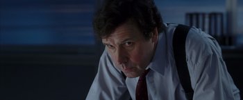 Movie still from “V for Vendetta” (2005), directed by James McTeigue – A person wearing a shirt and a tie; Close Up shot, Low angle