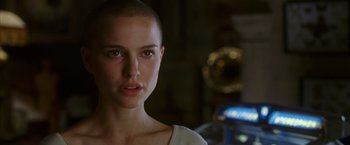Movie still from “V for Vendetta” (2005), directed by James McTeigue – A person with a shaved head; Close Up shot, Low angle