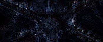 Movie still from “V for Vendetta” (2005), directed by James McTeigue – An aerial view of a city at night; Extreme Wide shot, Overhead angle