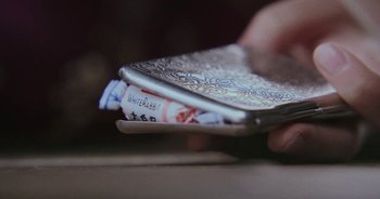 Movie still from “Amanda Sum - Groupthink” (2020), directed by Mayumi Yoshida – Extreme Close Up shot, Overhead angle