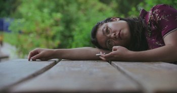 Movie still from “Amanda Sum - Groupthink” (2020), directed by Mayumi Yoshida – Close Up shot, High angle