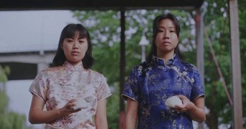 Movie still from “Amanda Sum - Groupthink” (2020), directed by Mayumi Yoshida – Medium shot, Low angle