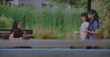 Movie still from “Amanda Sum - Groupthink” (2020), directed by Mayumi Yoshida – Medium shot, Low angle